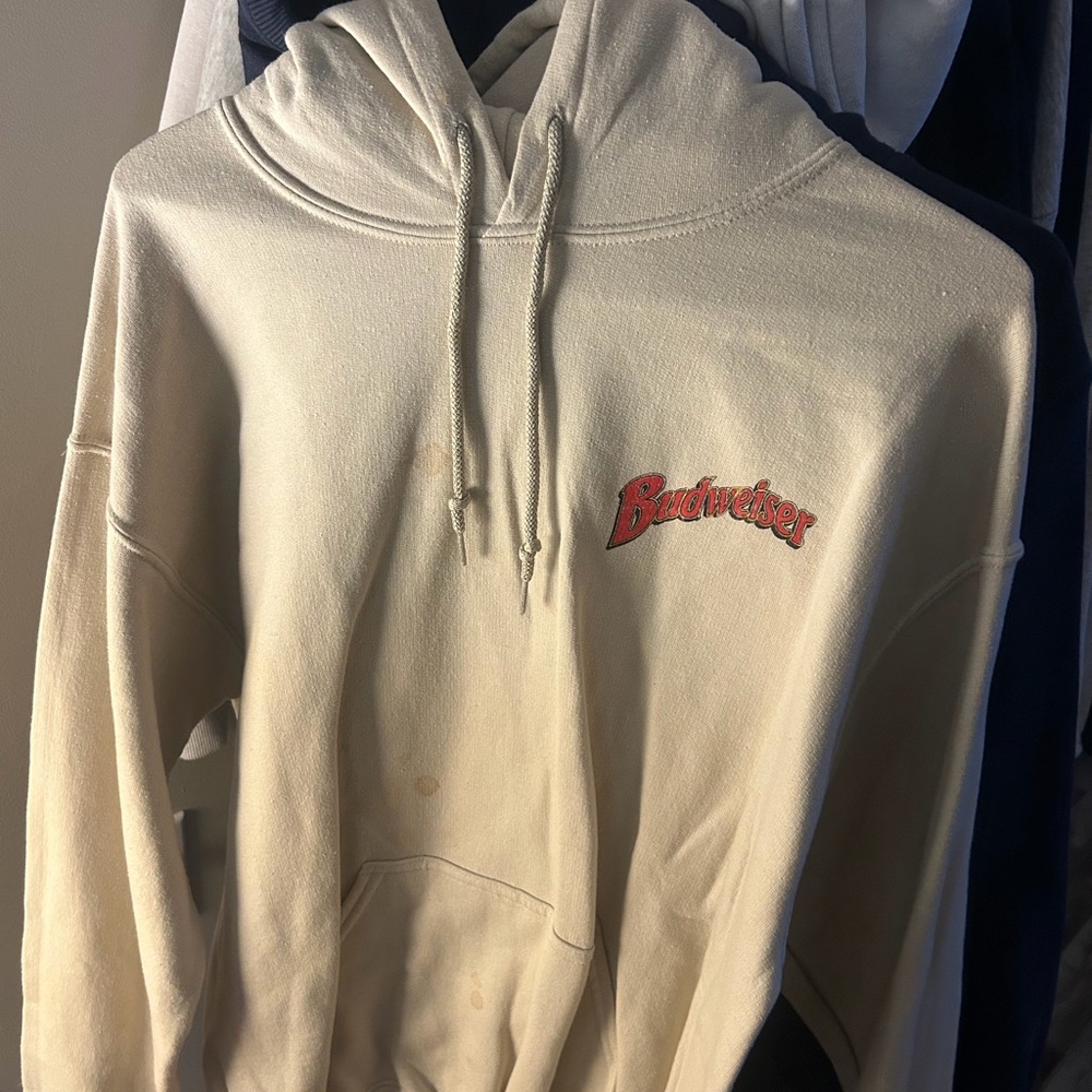 Source Unknown Cream Hoodie with Red Logo